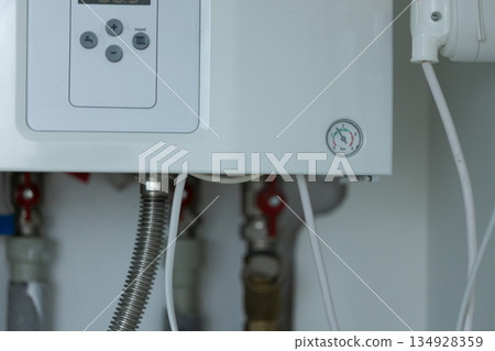 Heating gas boiler control panel with buttons. Symbolic image of the heating season at home. 134928359
