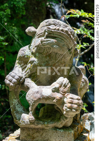 Stone komainu statue at Mitaki-Dera temple in Hiroshima, Japan 134928759