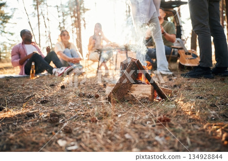 Group of friends are together in the forest Group of friends are together in the forest 134928844