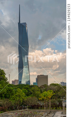 Merdeka 118 tower, a modern architectural landmark in Kuala Lumpur, Malaysia, under a dramatic cloudy sky. Merdeka 118 tower, a modern architectural landmark in Kuala Lumpur, Malaysia, under a dramatic cloudy sky. 134929153