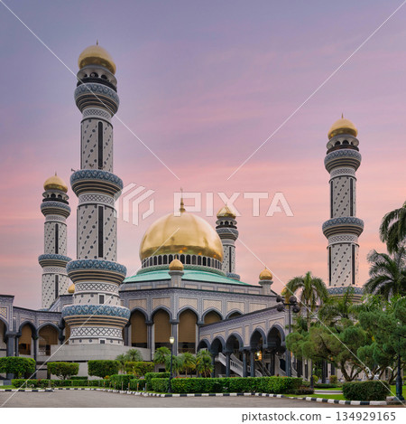 Jame' Asr Hassanil Bolkiah Mosque, Bandar Seri Begawan, Brunei. Golden domes and ornate minarets at dusk. Jame' Asr Hassanil Bolkiah Mosque, Bandar Seri Begawan, Brunei. Golden domes and ornate minarets at dusk. 134929165