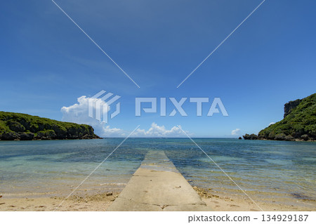 A boat ramp stretching out towards the beautiful sea A boat ramp stretching out towards the beautiful sea 134929187