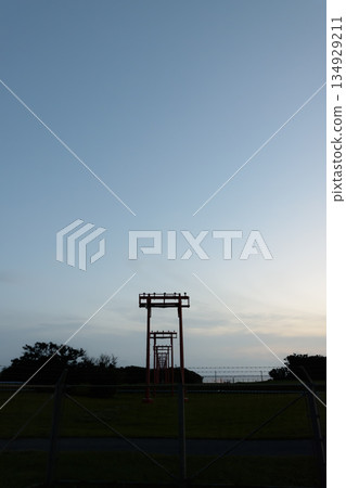 In the evening, the airport's guide lights point towards the blue sky and the sea In the evening, the airport's guide lights point towards the blue sky and the sea 134929211