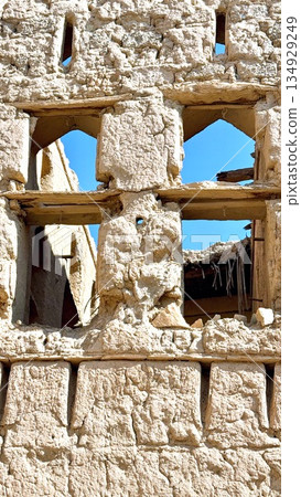 Aged Wall Deterioration, Conservator Documents Surface Deterioration On Ancient Adobe Architecture, Preservationist Captures Deterioration And Texture Details On Centuriesold Masonry Surface 134929249