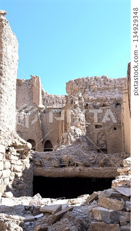 Ruined Courtyard Exploration, Discovering Abandoned Architectural Remains, Filmmaker Examines Historic Ruins And Structural Details, Ancient Site Featuring Broken Foundations And Dramatic Shadows 134929348