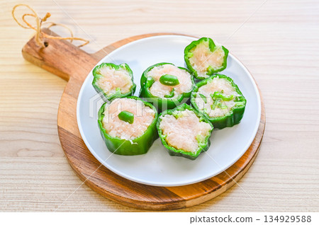 Stuffed peppers sliced before baking Stuffed peppers sliced before baking 134929588