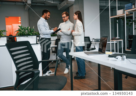 In the modern office. Couple are getting consulted by a manager 134930143