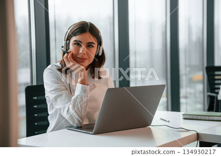Beautiful young woman is working in the office by laptop 134930217