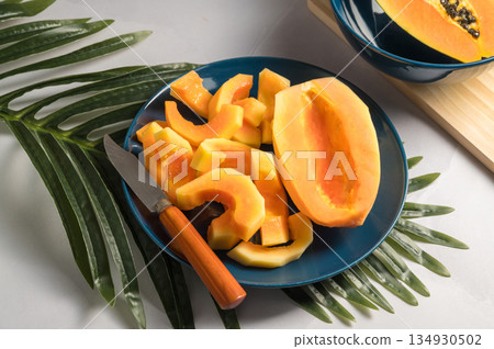 Papaya exotic fruit slices on plate. Healthy vegan food. Papaya exotic fruit slices on plate. Healthy vegan food. 134930502