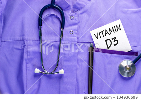 Vitamin D3 symbol. Concept words Vitamin D3 on beautiful white card. Stethoscope and pen. Beautiful medical uniform. Medical healthy lifestyle Vitamin D3 concept. 134930699