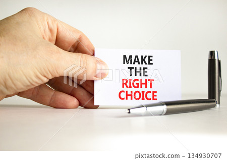 Make the right choice symbol. Concept words phrase Make the right choice on beautiful card. Businessman's hand. Beautiful white paper background. Business Make the right choice concept. Copy space. Make the right choice symbol. Concept words phrase Make the right choice on beautiful card. Businessman's hand. Beautiful white paper background. Business Make the right choice concept. Copy space. 134930707