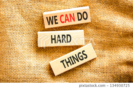 Support, help we can do hard things symbol. Concept words We can do hard things on beautiful wooden blocks. Beautiful canvas background. Business we can do hard things concept. Copy space. Support, help we can do hard things symbol. Concept words We can do hard things on beautiful wooden blocks. Beautiful canvas background. Business we can do hard things concept. Copy space. 134930725