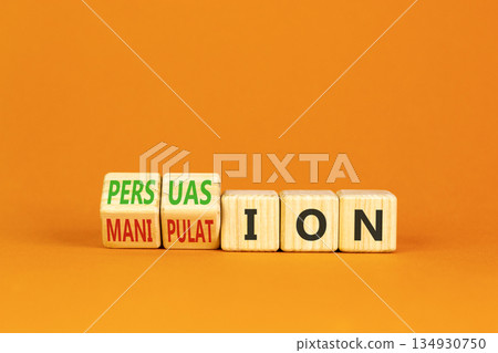 Persuasion or manipulation symbol. Concept words Persuasion and Manipulation on wooden cubes. Beautiful orange background. Psychology persuasion manipulation concept. Copy space. 134930750