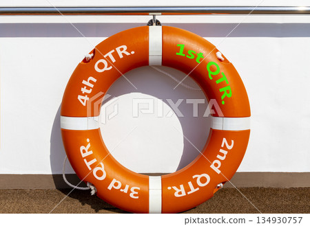 1st first quarter symbol. Beautiful orange lifebuoy with words 1st QTR. Beautiful white background. Business, happy 1st first quarter Q1 concept. Copy space. 1st first quarter symbol. Beautiful orange lifebuoy with words 1st QTR. Beautiful white background. Business, happy 1st first quarter Q1 concept. Copy space. 134930757