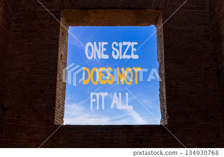 One size does not fit all symbol. Concept words One size does not fit all on beautiful window in brick wall. Beautiful blue sky background. Business one size does not fit all concept. Copy space. One size does not fit all symbol. Concept words One size does not fit all on beautiful window in brick wall. Beautiful blue sky background. Business one size does not fit all concept. Copy space. 134930768