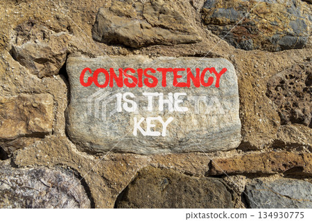 Consistency is the key symbol. Concept words Consistency is the key on beautiful grey stone. Beautiful stone wall background. Business consistency is the key concept. Copy space. 134930775