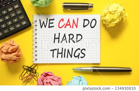 Support, help we can do hard things symbol. Concept words We can do hard things on beautiful white note. Beautiful yellow background. Black pen. Business we can do hard things concept. Copy space. 134930810