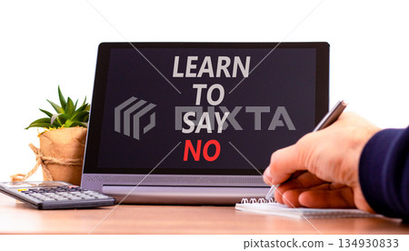 Learn to say no symbol. Concept words phrase Learn to say no on beautiful black tablet. Businessman's hand. Beautiful white background. Business psychological Learn to say no concept. Copy space. 134930833