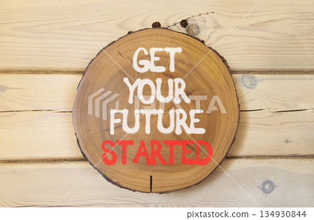 Get your future started symbol. Concept words Get your future started on beautiful wooden circle. Beautiful wooden wall background. Business get your future started concept. Copy space. Get your future started symbol. Concept words Get your future started on beautiful wooden circle. Beautiful wooden wall background. Business get your future started concept. Copy space. 134930844