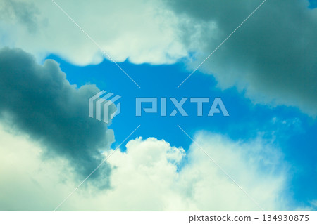 Deep blue sky background with white clouds 134930875