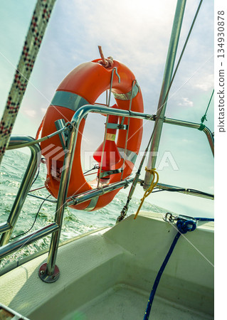 Rescue red lifebuoy life preserver saver ring on sailboat Rescue red lifebuoy life preserver saver ring on sailboat 134930878