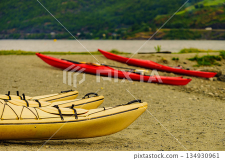 Kayaks on fjord shore, Flam, Norway Kayaks on fjord shore, Flam, Norway 134930961