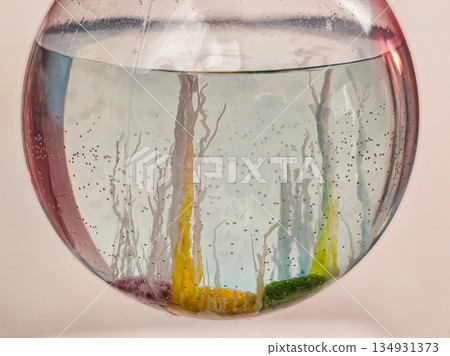 Close-Up Glass Flask with Fully Grown Crystals on Table 134931373