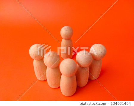 Six wooden peg dolls on an orange background. These types of photos are commonly used as visual metaphors in various contexts, particularly in business, psychology, and education Six wooden peg dolls on an orange background. These types of photos are commonly used as visual metaphors in various contexts, particularly in business, psychology, and education 134931494