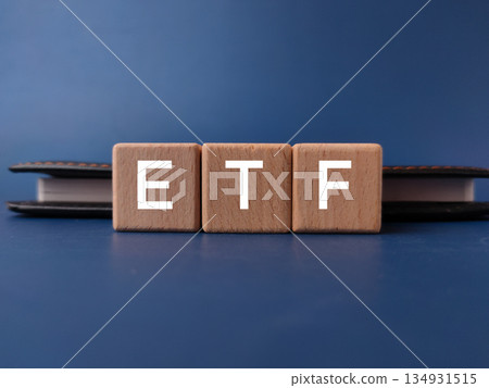 The image displays wooden blocks spelling out ETF, which stands for Exchange-Traded Fund. The image displays wooden blocks spelling out ETF, which stands for Exchange-Traded Fund. 134931515