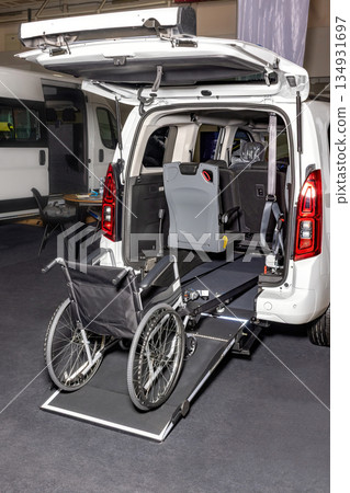Innovative wheelchair-accessible van with a sleek ramp for smooth mobility. 134931697