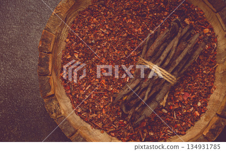 Madder dye, Endro, rhizome for coloring eggs, powder from the roots of endro with onion husks, in a wooden plate, top view, Easter, Georgia, Madder dye, Endro, rhizome for coloring eggs, powder from the roots of endro with onion husks, in a wooden plate, top view, Easter, Georgia, 134931785