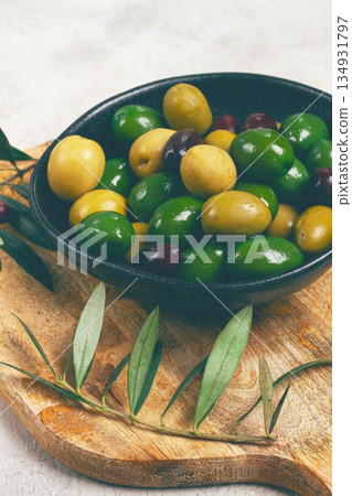 a mixture of olives, varieties of chalkidiki, Verdi giganti and Kalamata, in a bowl, top view, no people, a mixture of olives, varieties of chalkidiki, Verdi giganti and Kalamata, in a bowl, top view, no people, 134931797
