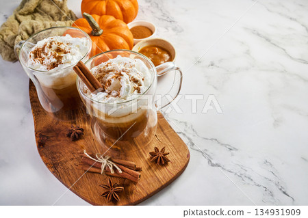 Pumpkin spice lattes with whipped cream and cinnamon Pumpkin spice lattes with whipped cream and cinnamon 134931909