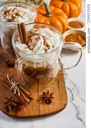Pumpkin spice latte with whipped cream and cinnamon 134931910