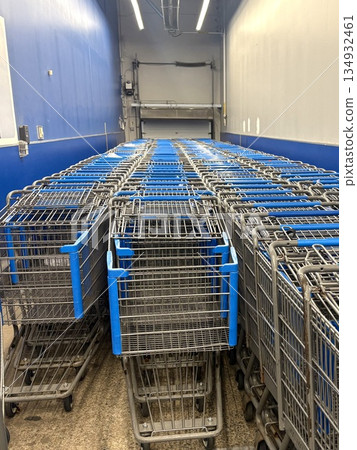 Orderly rows of shopping carts Inside a supermarket Orderly rows of shopping carts Inside a supermarket 134932461