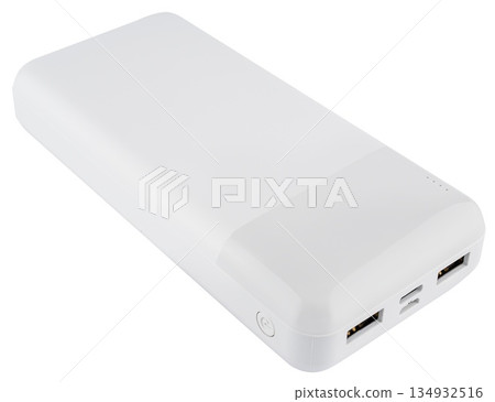 White compact power bank with two USB ports and a charge level indicator. On a white background White compact power bank with two USB ports and a charge level indicator. On a white background 134932516