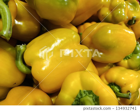 Yellow bell peppers displaying vibrant color and healthy texture, representing fresh produce, organic farming, and a nutritious food ingredient in cooking and healthy eating Yellow bell peppers displaying vibrant color and healthy texture, representing fresh produce, organic farming, and a nutritious food ingredient in cooking and healthy eating 134932741