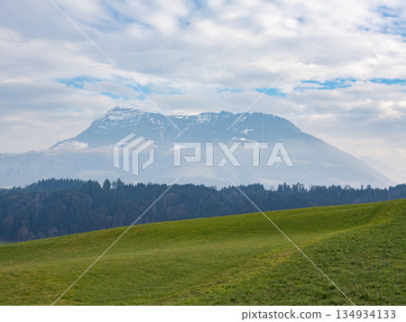 Rigi, Switzerland - February 9th 2025: View from a green field towards mount Rigi, a famous peak in Switzerland, Europe 134934133