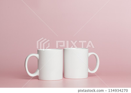 white cups for tea or coffee on a pink background 134934270