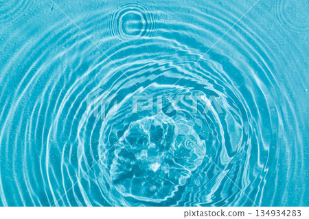 drops on water with circles on a blue background drops on water with circles on a blue background 134934283