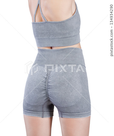 Sports jacket of grey color, women's sports suit seamless, jacket for yoga training on a girl on an isolated white background Sports jacket of grey color, women's sports suit seamless, jacket for yoga training on a girl on an isolated white background 134934290