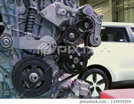 Vehicle Engine In Section On The Stand Over White Car 134934369