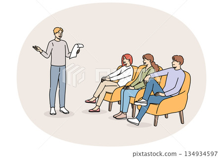 Poetry evening with man reading own poems, for positive listeners sitting in armchairs 134934597