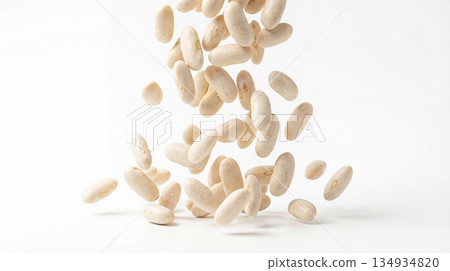 Dry white beans falling on white background 134934820