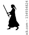 A small person holding a wooden sword (silhouette, black) 134934824