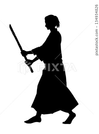 A man in a karate uniform holding a wooden sword (silhouette, black) 134934826