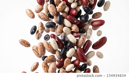 Different types of dry beans falling on white background 134934834
