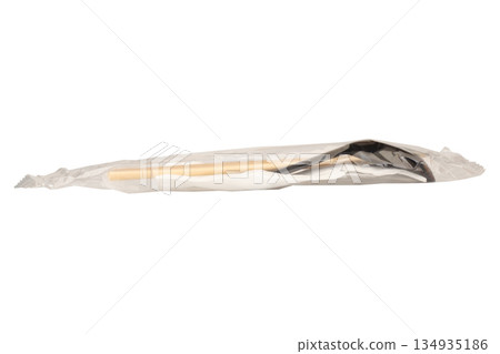 Spoons chopsticks and tissues are in a clear plastic bag These are eating utensils isolated on white background Spoons chopsticks and tissues are in a clear plastic bag These are eating utensils isolated on white background 134935186