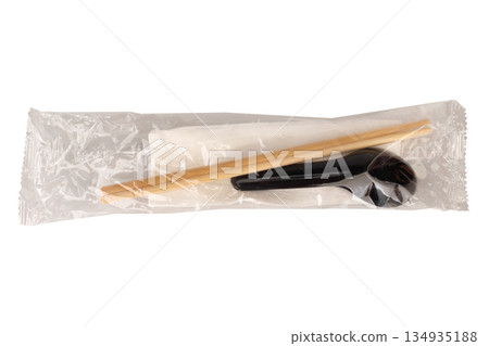 Spoons chopsticks and tissues are in a clear plastic bag These are eating utensils isolated on white background Spoons chopsticks and tissues are in a clear plastic bag These are eating utensils isolated on white background 134935188