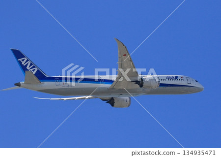 ANA plane ascending ANA plane flying in the blue sky 134935471